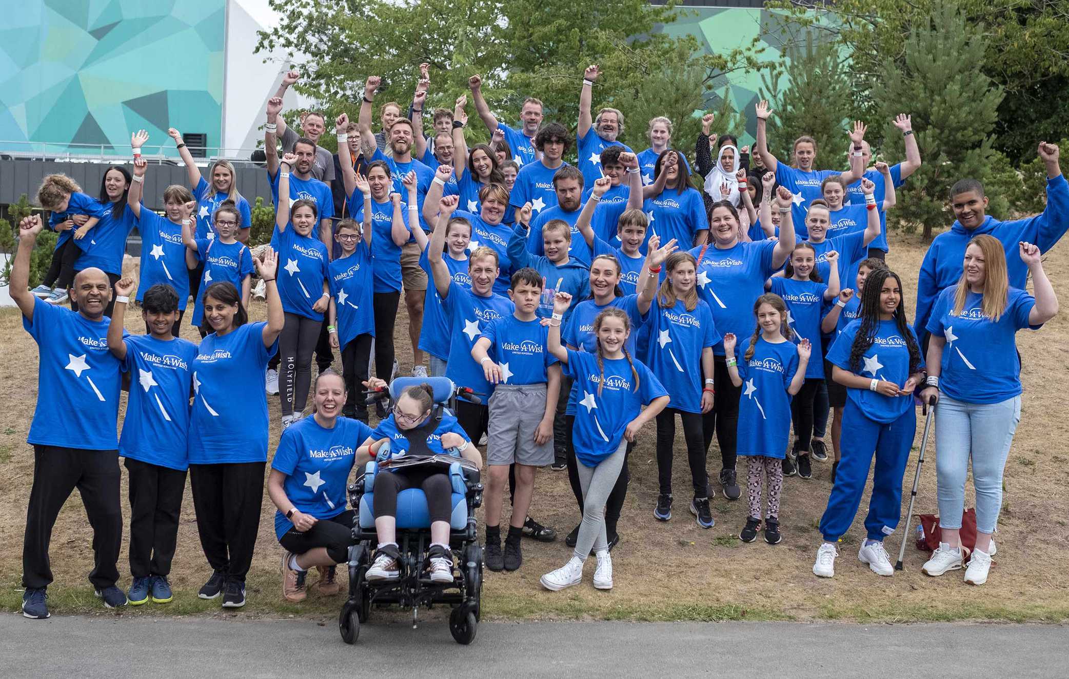 A group photo of the families, staff and volunteers that attended the Wish Alumni event at Bear Grylls Adventure Park.