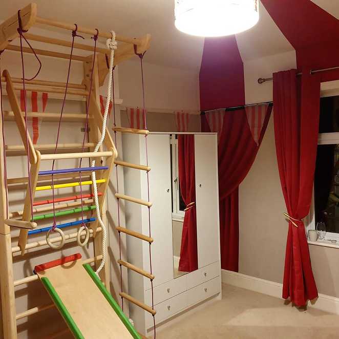 Lottie's wall mounted climbing frame, complete with slide.