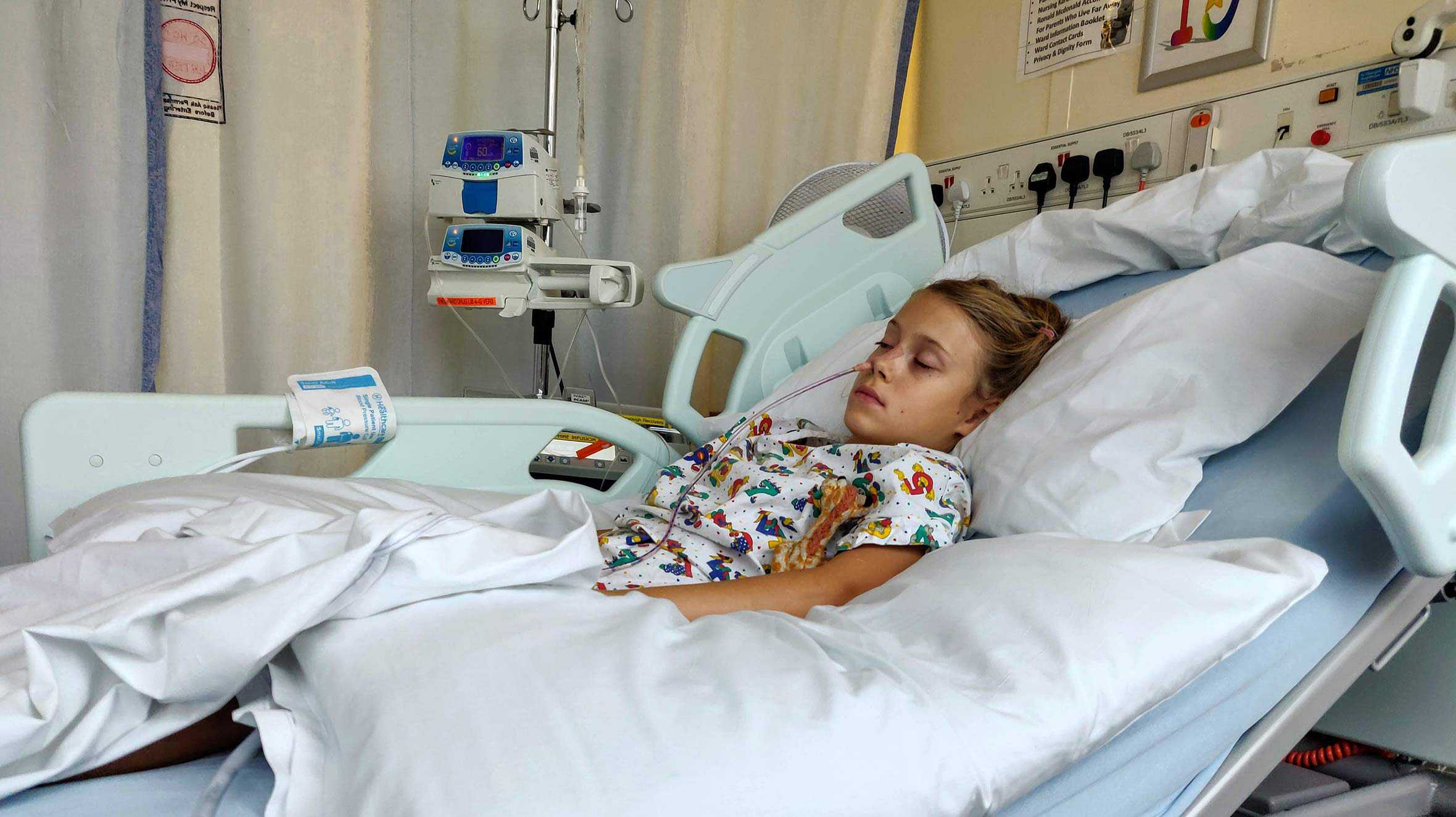 Leila in her hospital bed during treatment for her condition.